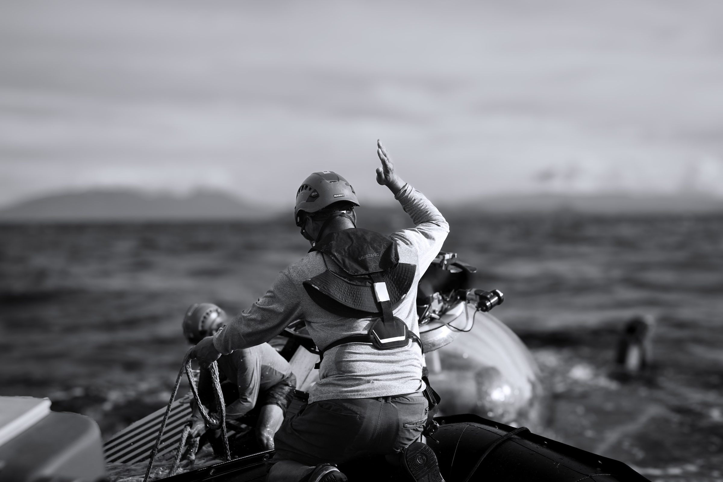 Crew member signaling from a RIB near a submersible