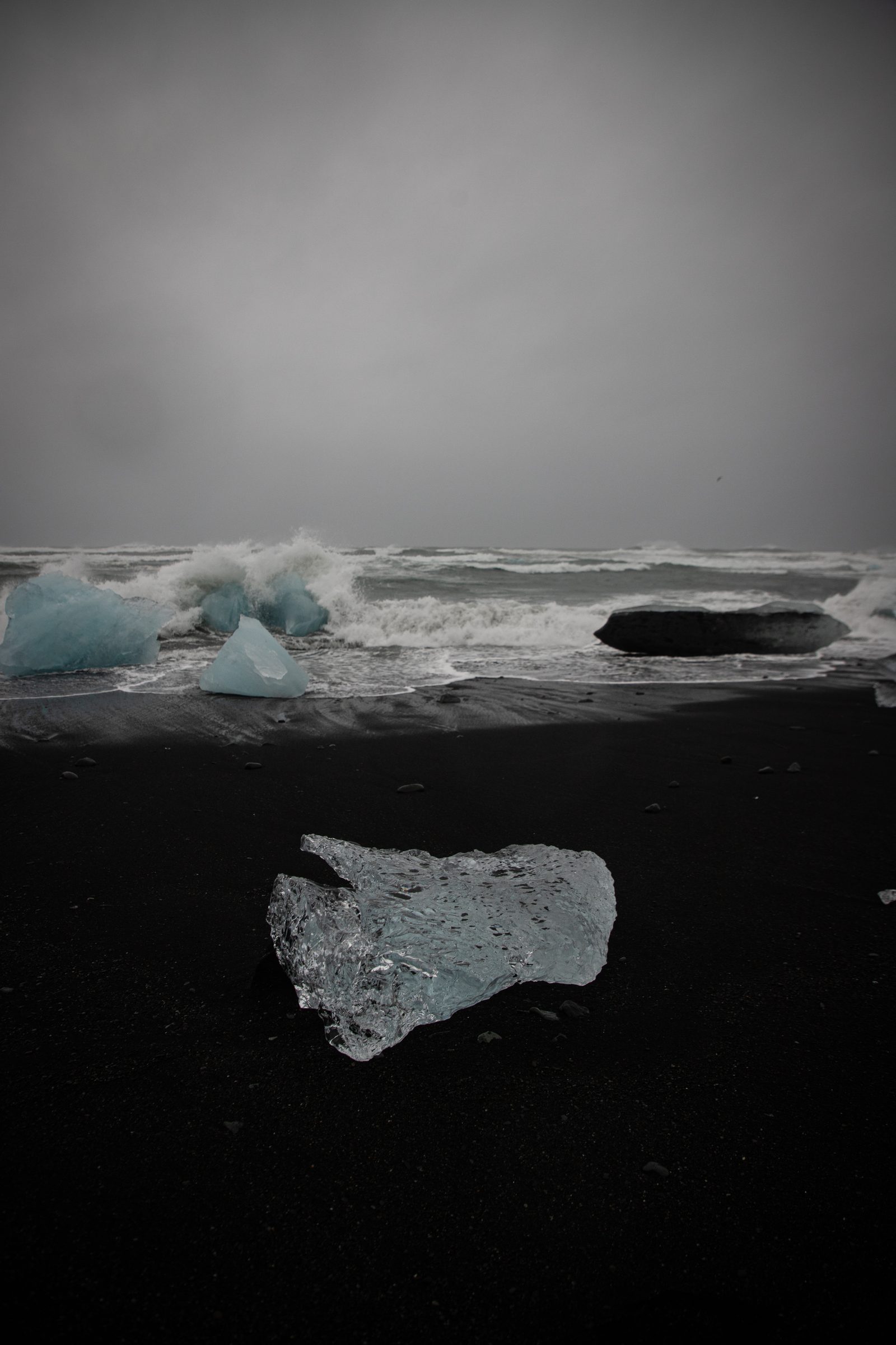 Glacier ice on a black volcanic sand beach